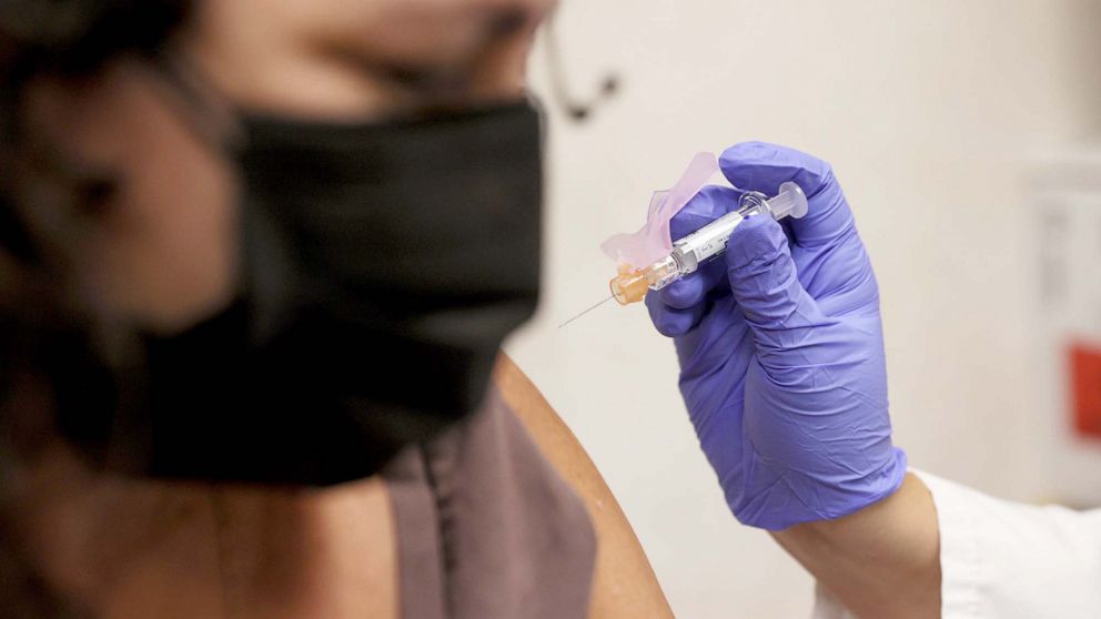 PHOTO: Susana Sanchez, a Nurse Practitioner, administers a flu vaccination to Ana Maria Flores in Miami, Sept. 10, 2021.