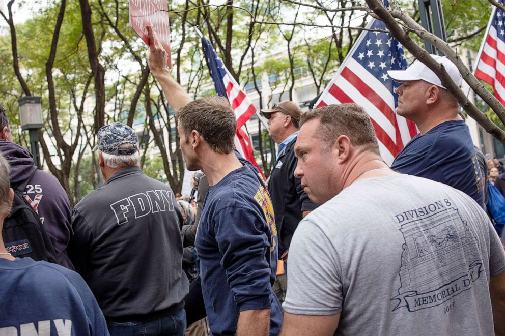 PHOTO:City workers, including FDNY, hold a protest march and rally over the Brooklyn Bridge to City Hall to voice their opposition to a city mandate to receive the COVID-19 vaccine or lose their jobs in Brooklyn area of New York, Oct. 25, 2021. 