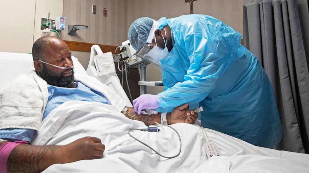 PHOTO: A nurse treats COVID-19 patient Cedric Daniels, 37, of Gonzales, La., at Our Lady of the Lake Regional Medical Center in Baton Rouge, Aug. 2, 2021.