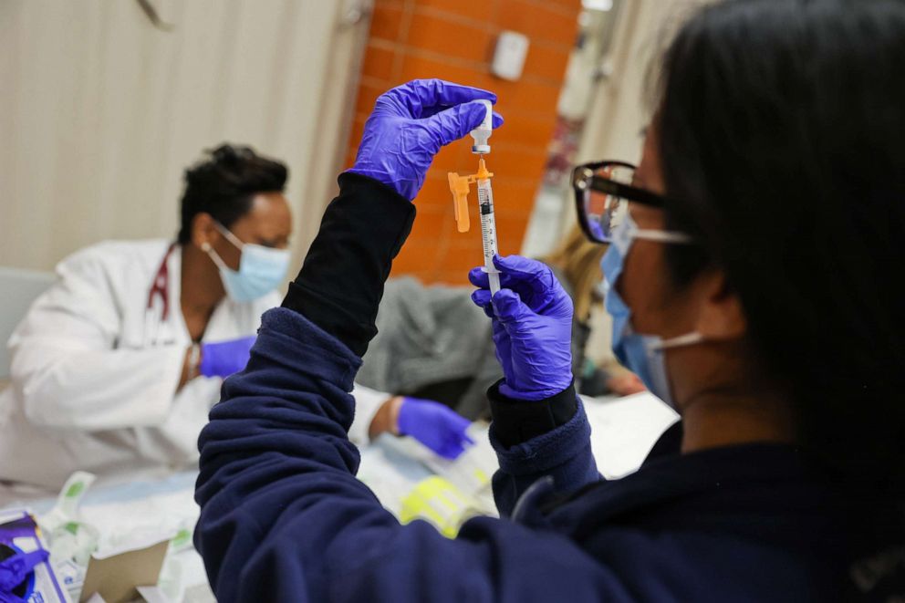 PHOTO: Dr. Twana Jackson prepares pediatric doses of the Pfizer COVID-19 vaccine as the Mount Sinai South Nassau Vaxmobile vists Freeport High School in Freeport, N.Y.,  Nov. 30, 2021. 