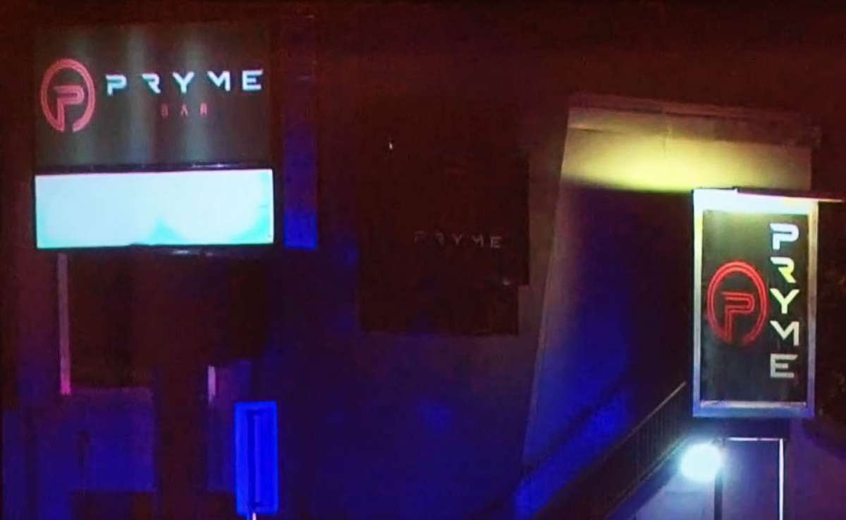 PHOTO: Signage for the nightclub Pryme is illuminated by lights from first responders after a shooting left one person dead and multiple others injured in Dallas during  the early morning hours of March 20, 2021.