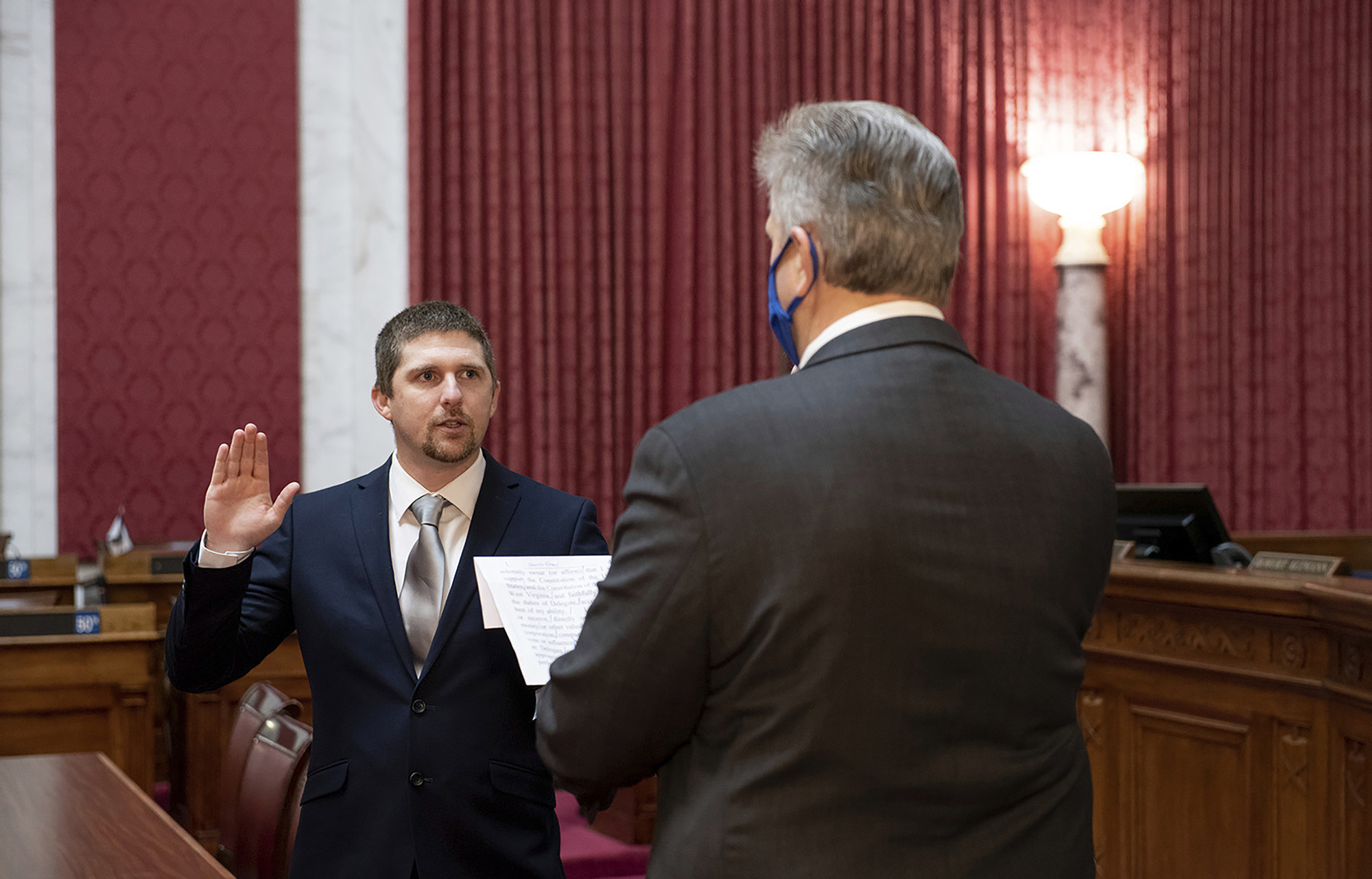PHOTO: West Virginia House of Delegates member Derrick Evans is given the oath of office in the House chamber at the state Capitol in Charleston, W.Va., Dec. 14, 2020.