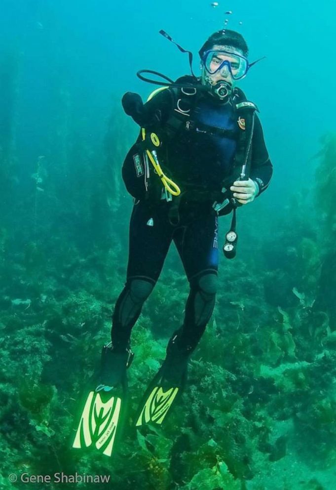 PHOTO: U.S. Army veteran Jared Lemon dives off the coast of Long Beach, Calif.