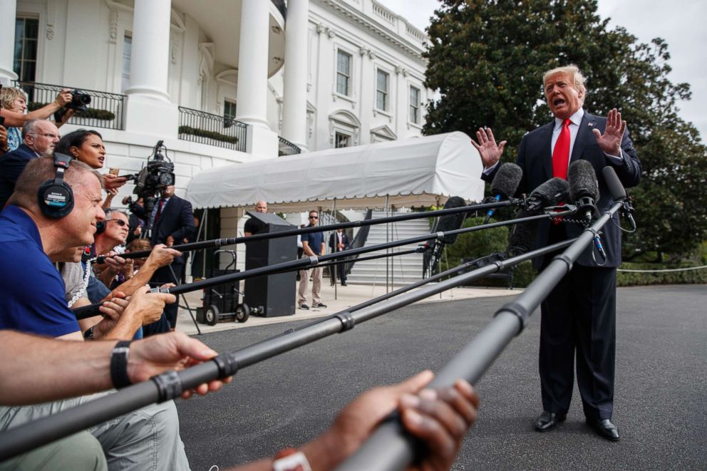 PHOTO: President Donald Trump speaks with reporters on the South Lawn of the White House, Oct. 8, 2018, in Washington.