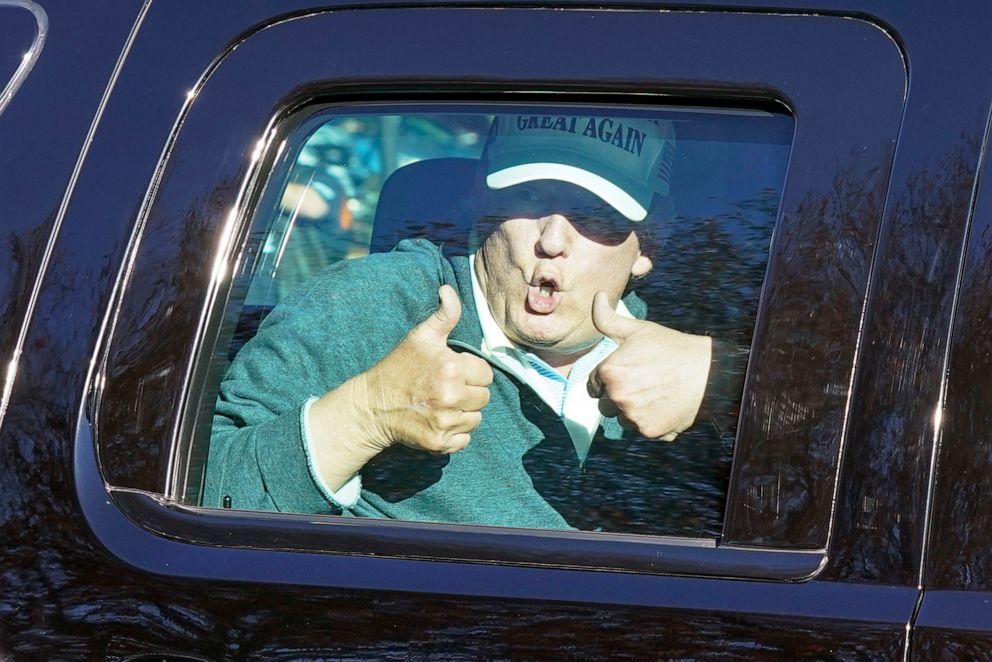 PHOTO: President Donald Trump gives two thumbs up to supporters as he departs after playing golf at the Trump National Golf Club in Sterling Va., Nov. 8, 2020.