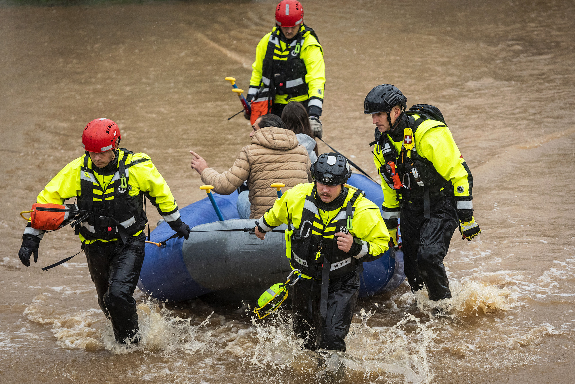 PHOTO: Firefighters with the Winston-Salem Fire Department evacuate residents at Creekwood Apartments as flood waters rise in Winston-Salem, N.C., Nov. 12,2020.