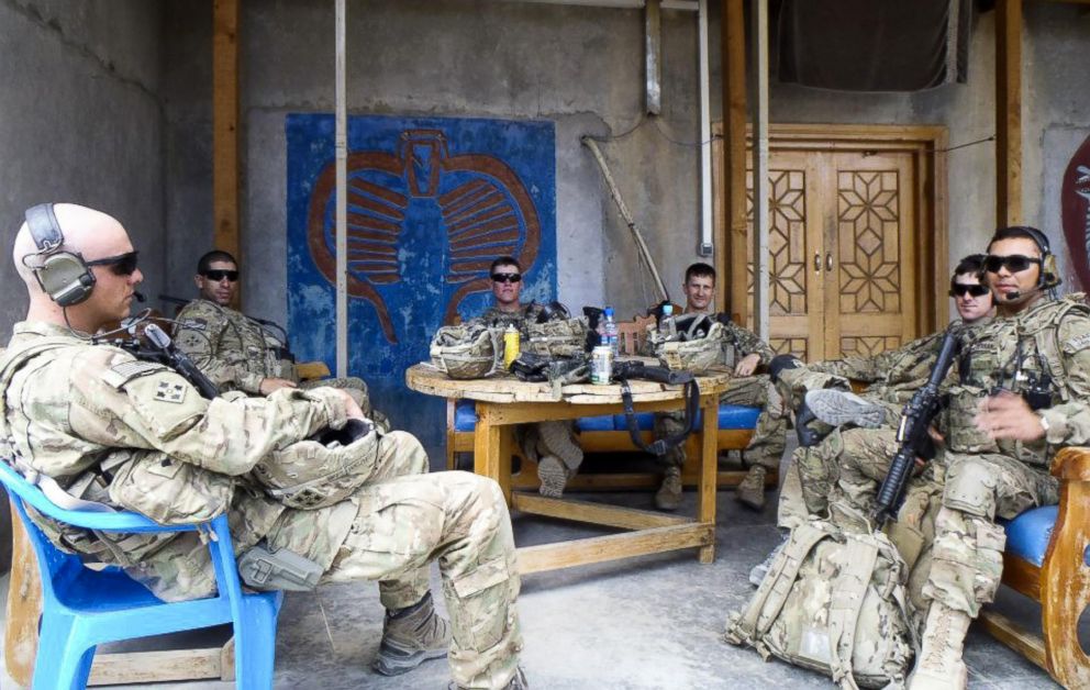 PHOTO: 1st Lt. Florent Groberg, second left, take some downtime during a deployment to Kunar Province, Afghanistan, 2012.