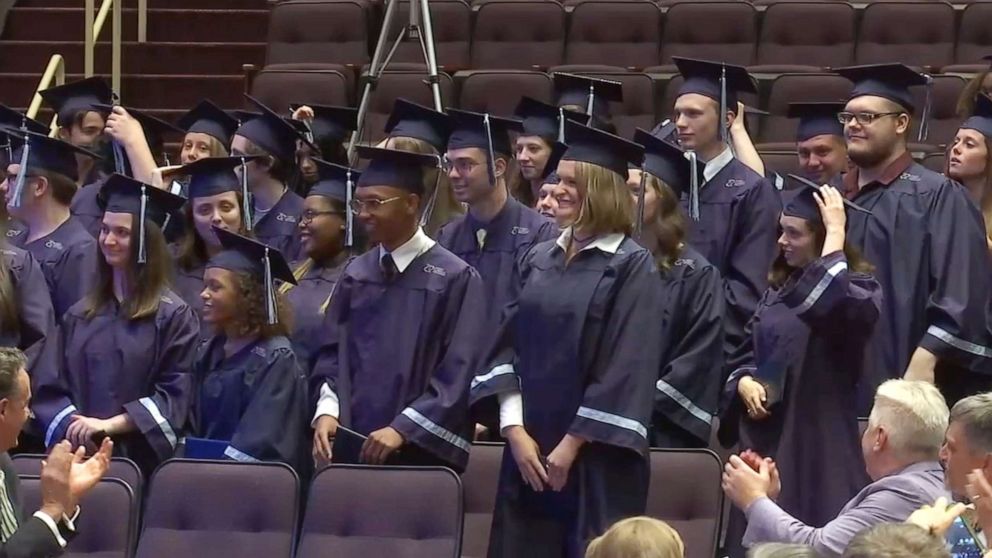 Online high school students meet each other for the first time at graduation