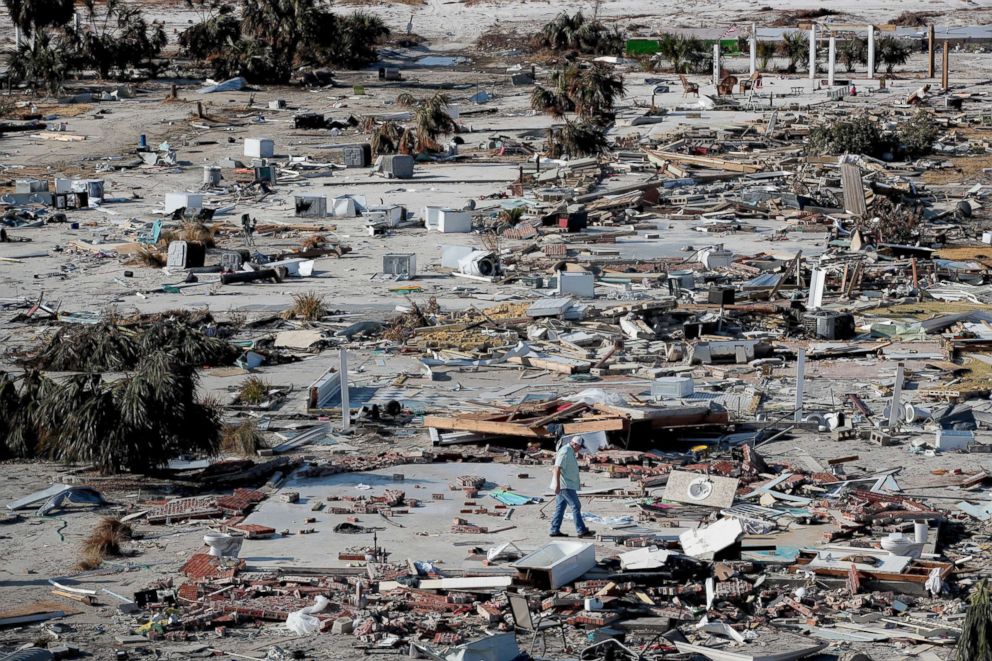 PHOTO: A man walks through a beachfront neighborhood that was decimated by Hurricane Michael, Oct. 16, 2018, in Mexico Beach, Florida.