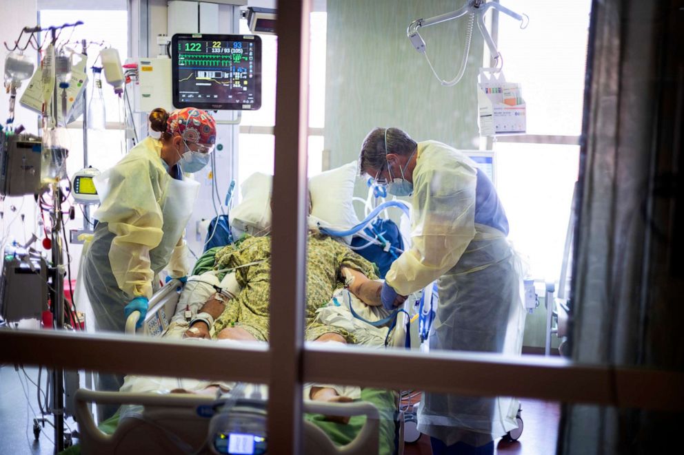 PHOTO: Medical professionals look over a COVID-19 patient in the Medical Intensive care unit at St. Luke's Boise Medical Center in Boise, Idaho on Aug. 31, 2021.