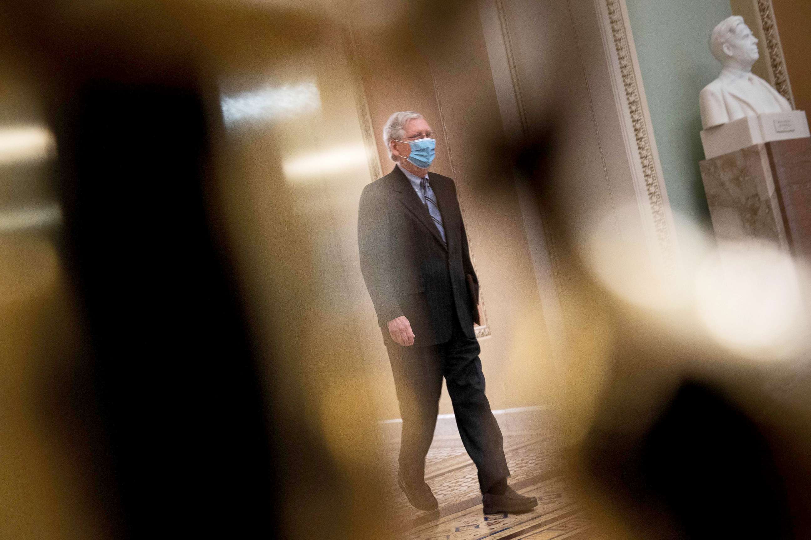 PHOTO: Senate Minority Leader Senator Mitch McConnell walks to the Senate floor during the fourth day of former President Donald Trump's impeachment trial before the Senate on Capitol Hill Feb. 12, 2021.