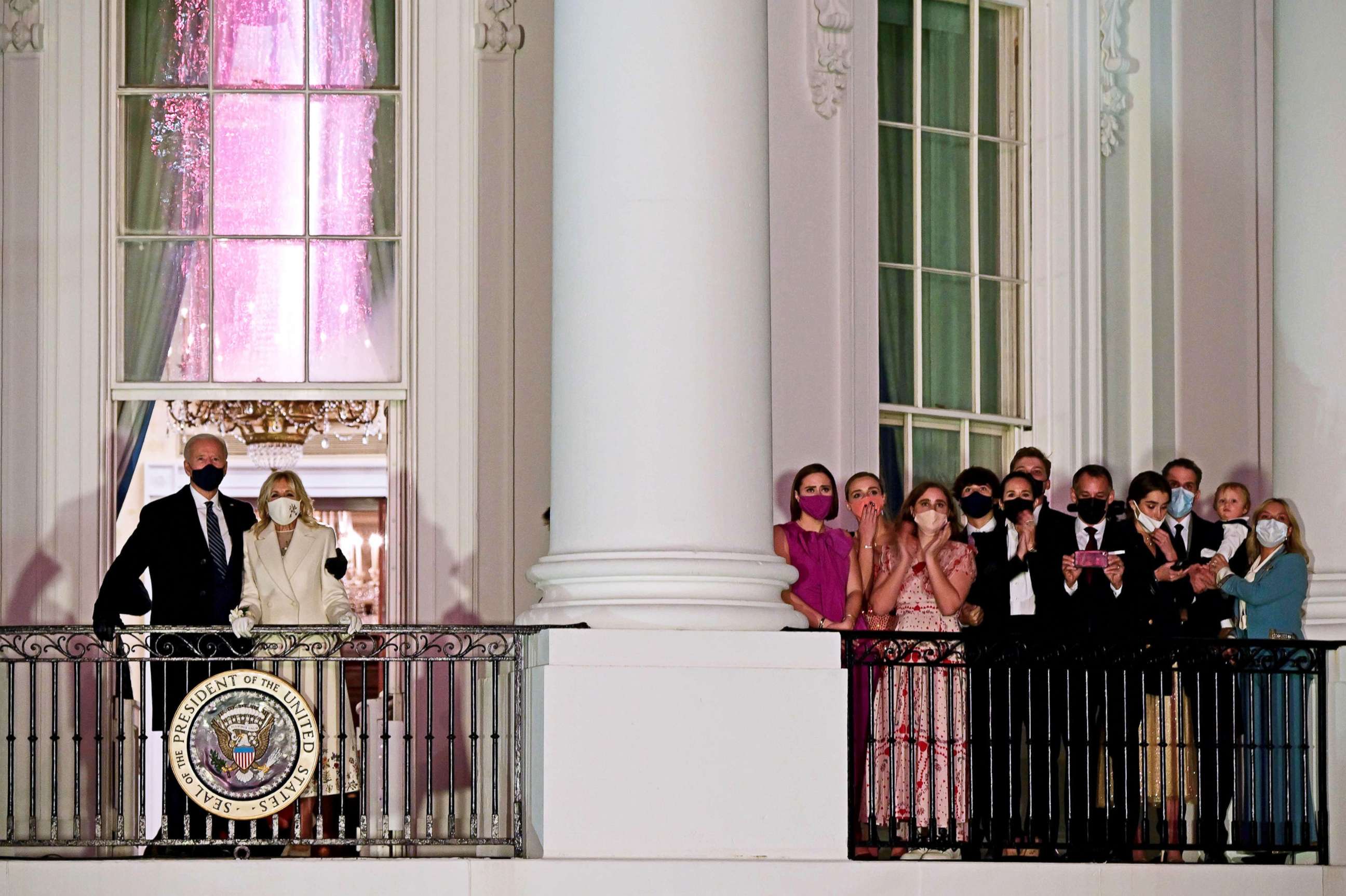 PHOTO: President Joe Biden  and First Lady Jill Biden appear on the Blue Room Balcony as they and family members watch fireworks from the White House in Washington, Jan. 20, 2021. 