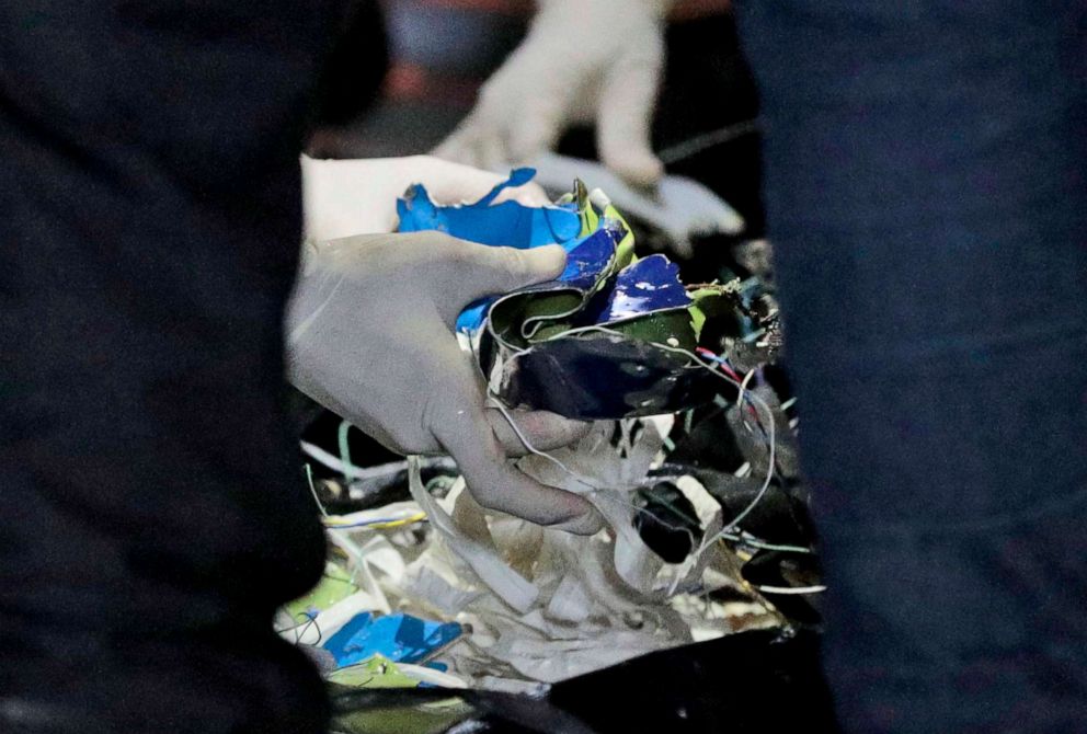 PHOTO: Rescuers examine debris found in the water off Java Island where a Sriwijaya Air passenger jet has lost contact with air traffic controllers, at Tanjung Priok Port in Jakarta, Indonesia, early Sunday, Jan. 10, 2021