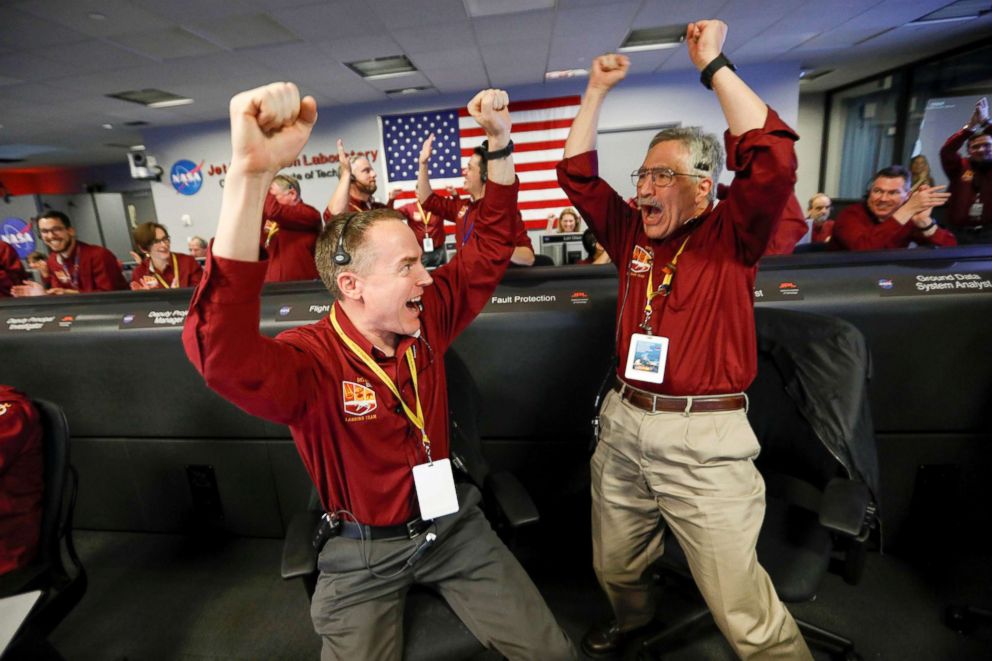 PHOTO: NASA engineers Kris Bruvold, left, and Sandy Krasner react in the space flight operation facility at NASA's Jet Propulsion Laboratory (JPL) as the spaceship InSight lands on the surface of Mars after a six-month journey, Nov. 26, 2018.