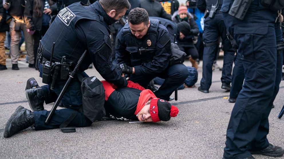 PHOTO: Police arrest a protester who is in favor of conviction in front of the Kenosha County Courthouse while the jury deliberates the Kyle Rittenhouse trial in Kenosha, Wis.,Nov. 17, 2021.