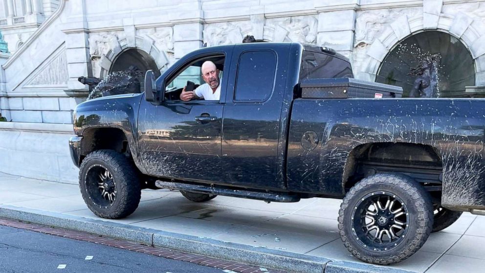PHOTO: A man sits in a pickup truck outside the Library of Congress and has allegedly told police that he has a bomb in Washington, Aug. 19, 2021.