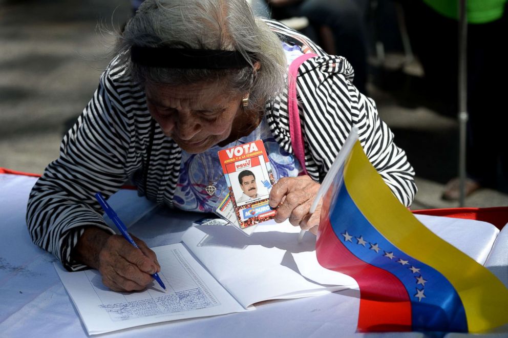 PHOTO: Supporters of Venezuelan President Nicolas Maduro gather at Bolivar square in Caracas to take part in a signature campaign to urge the United States to put a halt to intervention threats against Maduro's government, Feb. 7, 2019.