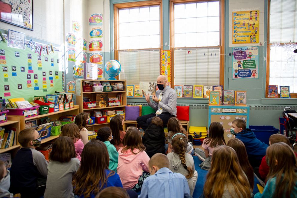PHOTO: Teacher Chris Huarte reads one of Arthur’s books to his 2nd grade students.