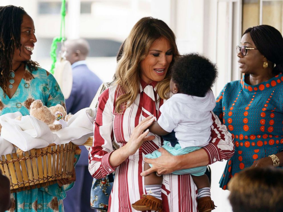 PHOTO: The First Lady, Melania Trump, carries a baby while she goes to the Greater Accra Regional Hospital in Accra, Ghana on October 2, 2018.