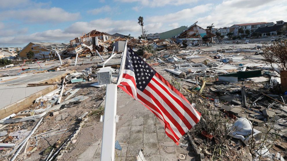 PHOTO: An American flag flies amidst destruction in the aftermath of Hurricane Michael in Mexico Beach, Fla., Oct. 11, 2018.