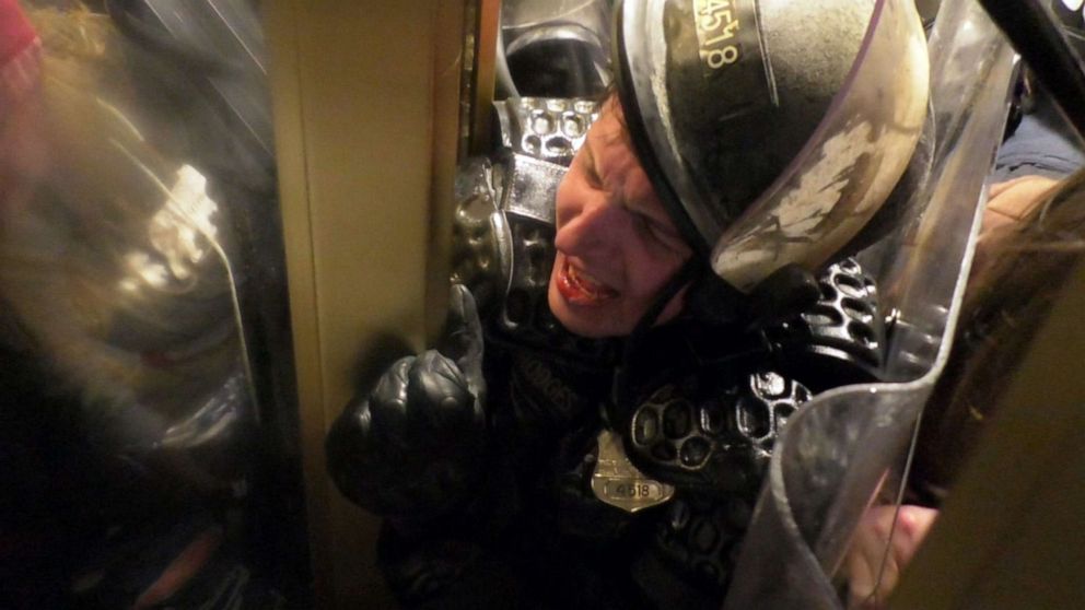 PHOTO: Officer Daniel Hodges of the Washington, D.C. Metropolitan Police Department is crushed in a doorway to the Capitol during the riot on Jan. 6, 2021, in Washington.