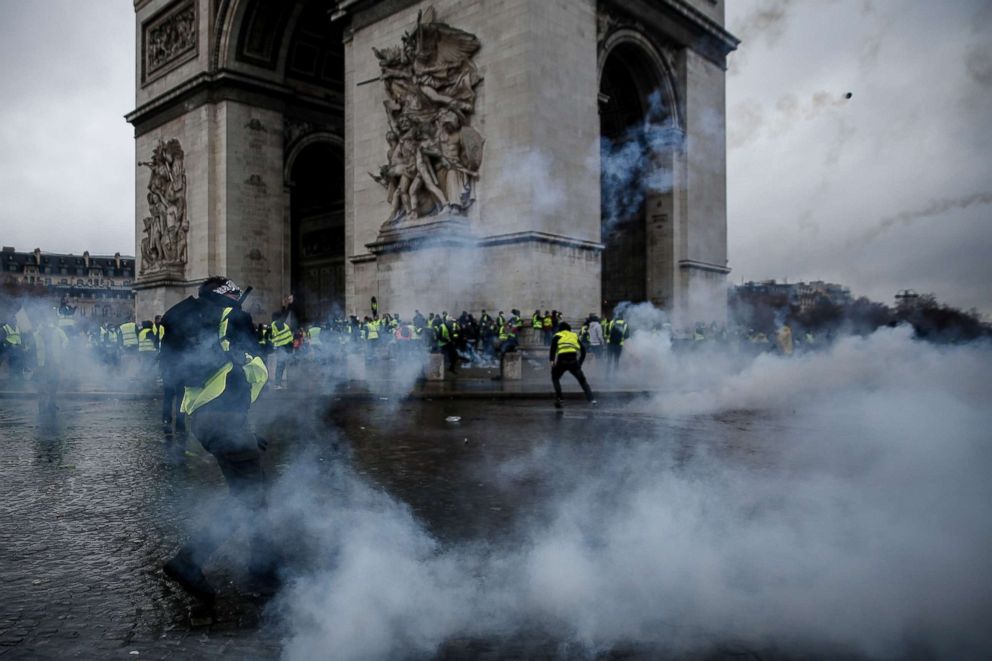 PHOTO: Demonstrators clash with riot police at the Arc de Triomphe during a protest of Yellow vests against rising oil prices and living costs, Dec. 1, 2018, in Paris. 