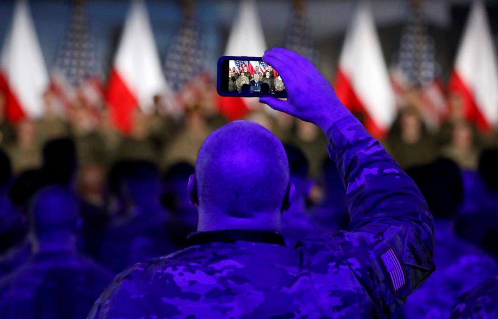 PHOTO: A U.S. army soldier takes a photo during Vice President Mike Pence's arrival at the airport in Warsaw, Poland, Feb. 13, 2019.