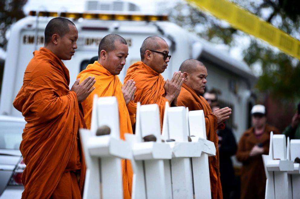 PHOTO: Buddhists pay their respects at a memorial outside the Tree of Life synagogue after a shooting there left 11 people dead in the Squirrel Hill neighborhood of Pittsburgh, Oct. 29, 2018.