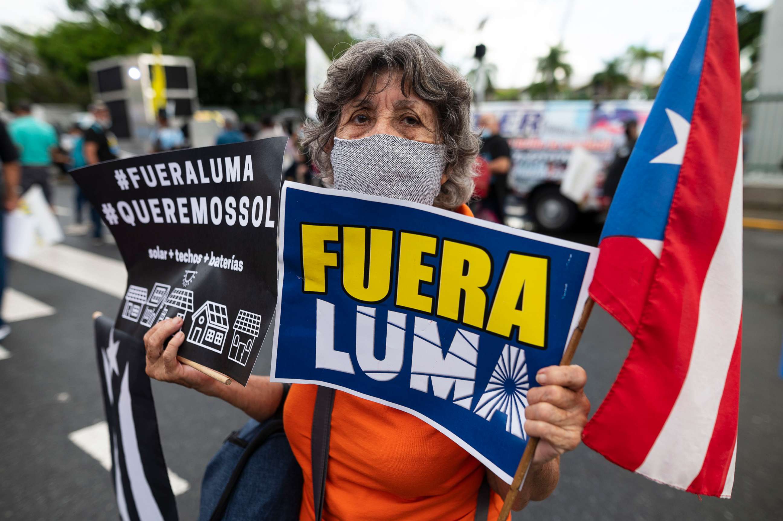 PHOTO: People march along Las Americas Highway to protest the LUMA Energy company in San Juan, Puerto Rico, Oct. 15, 2021. 