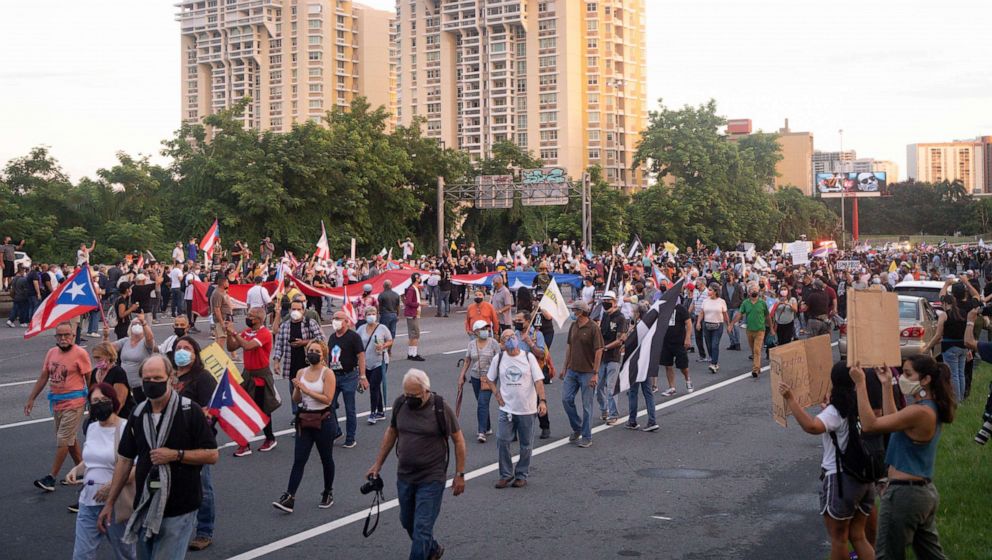 PHOTO: Protesters march during a demonstration against LUMA Energy in what organizers called All of Puerto Rico Against LUMA, Oct. 15, 2021, in San Juan, Puerto Rico.