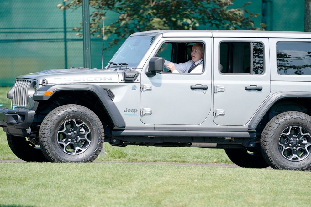PHOTO: President Joe Biden drives a Jeep Wrangler 4ex Rubicon during an event on clean cars and trucks, on the South Lawn of the White House, Aug. 5, 2021.