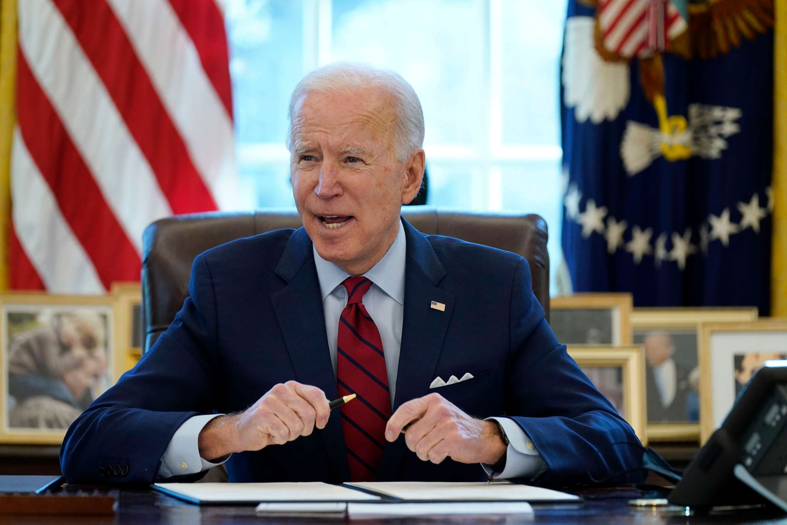 PHOTO: President Joe Biden signs a series of executive orders on health care, in the Oval Office of the White House, Thursday, Jan. 28, 2021, in Washington. (AP Photo/Evan Vucci)