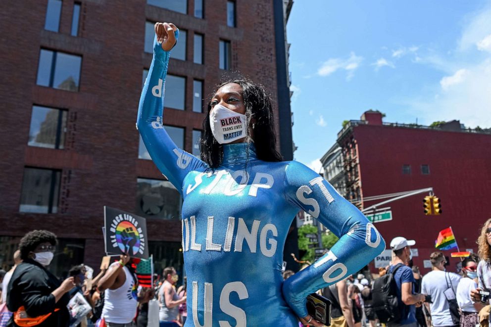 PHOTO: Mila Jam poses in a jumpsuit that reads, "Stop killing us" at the Queer Liberation March for Black Lives & Against Police Brutality in New York, June 28, 2020.