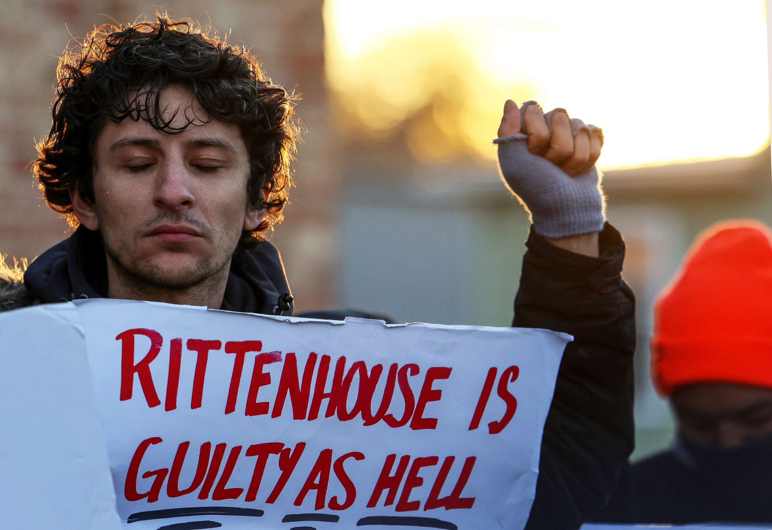 PHOTO: A man holds a placard as he protests again the verdict in the trial of Kyle Rittenhouse, in Kenosha, Wis., Nov. 19, 2021.
