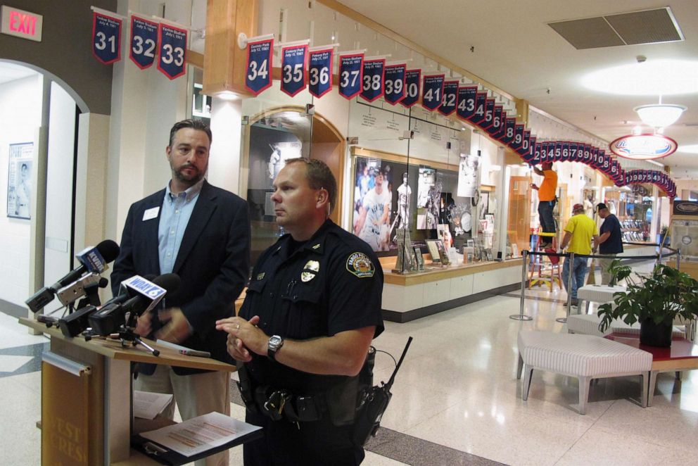 PHOTO: In this July 23, 2016, file photo, West Acres Mall property manager Chris Heaton, left, and Fargo Deputy Police Chief Joe Anderson talk in front of the Roger Maris Museum in Fargo, N.D..