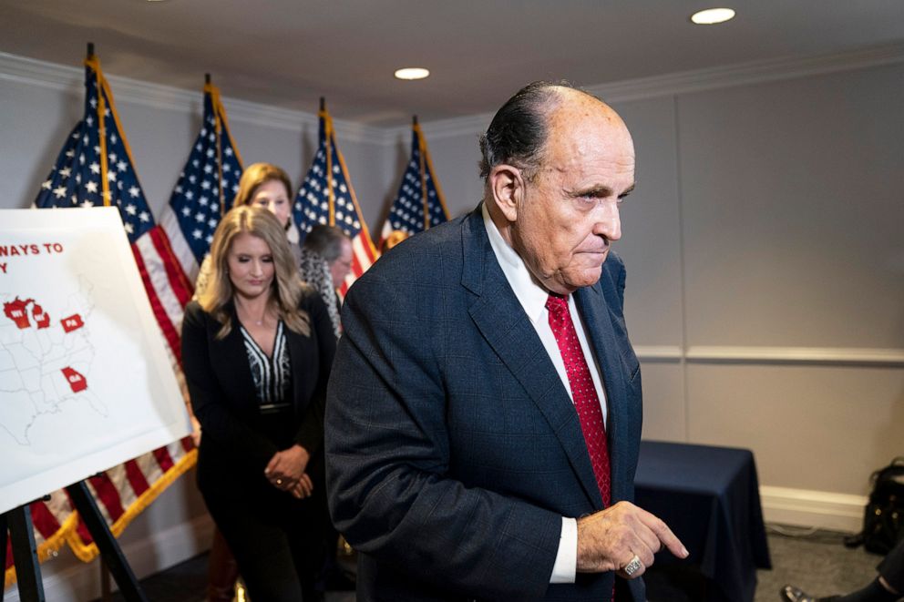 PHOTO: Rudy Giuliani exits after speaking to the press about various lawsuits related to the 2020 election,  inside the Republican National Committee headquarters in Washington, Nov. 19, 2020 