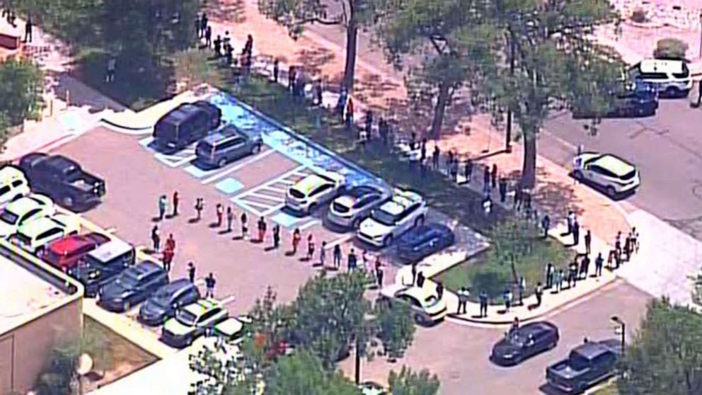 PHOTO: Parents and guardians arrive to pick up students from school after a shooting at Washington Middle School in Albuquerque, N.M., Aug. 13, 2021.