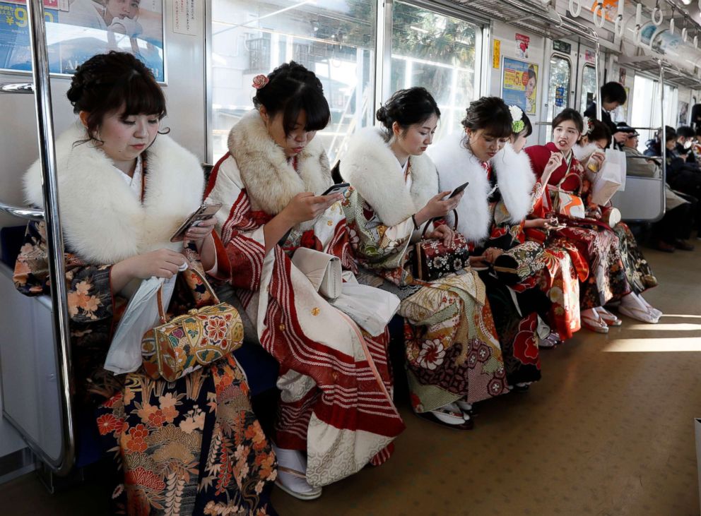 PHOTO: Kimono-clad women ride a train after attending a ceremony to celebrate "Coming-of-Age Day" in Tokyo, Jan. 14, 2019. Men and women celebrate as they are formally recognized as adults in Japanese society at the age of 20.