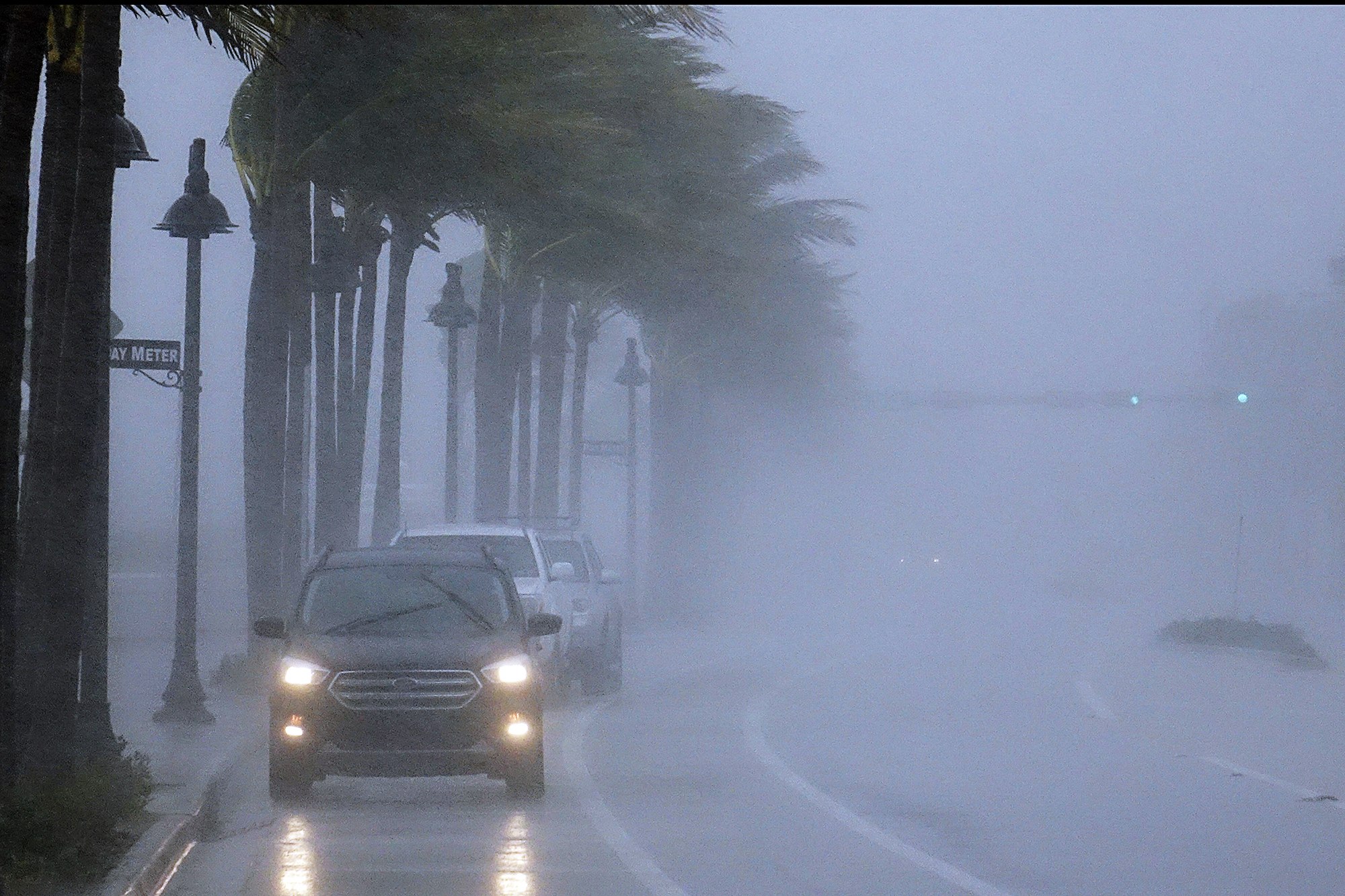 PHOTO:Cars move along highway A1A  with poor visability in Fort Lauderdale, Fla., Nov. 8, 2020.