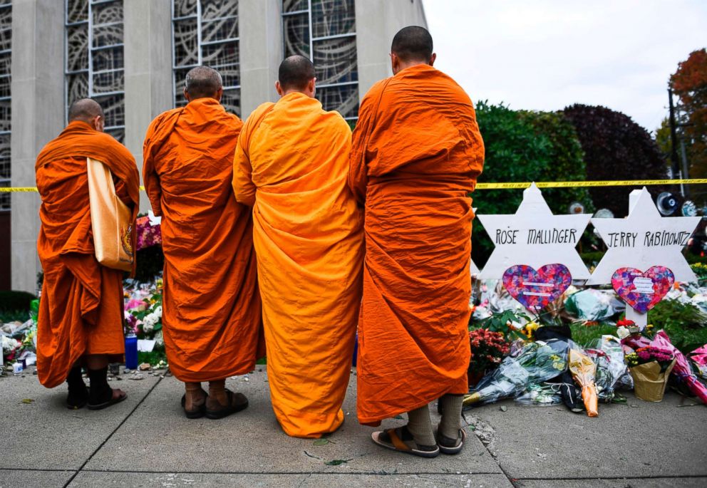 PHOTO: Buddhists pay their respects at a memorial outside the Tree of Life synagogue after a shooting there left 11 people dead in the Squirrel Hill neighborhood of Pittsburgh, Pennsylvania, Oct. 29, 2018.