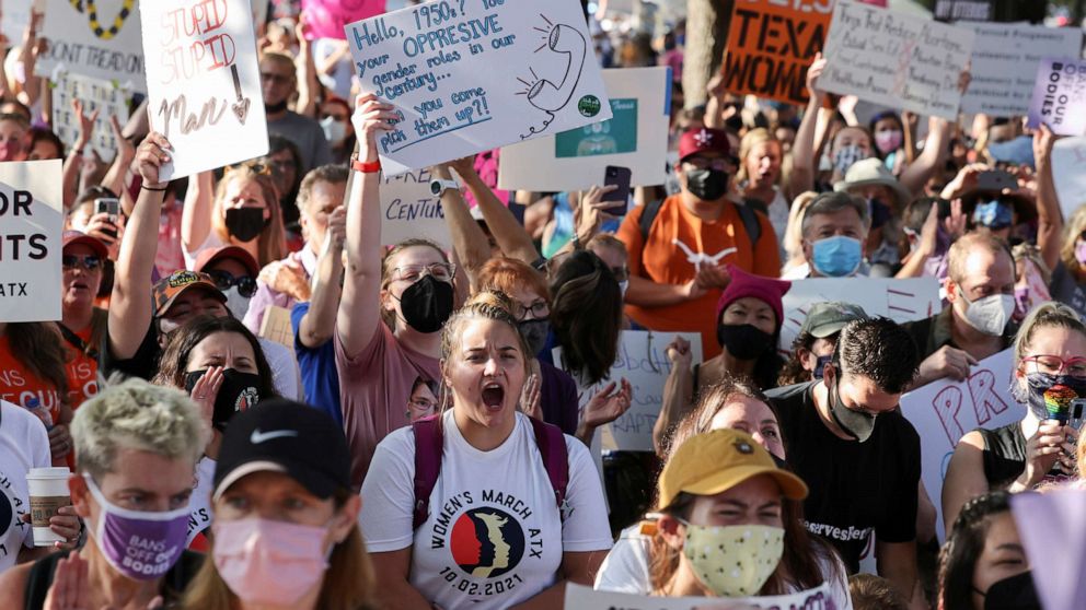 PHOTO: Women's rights advocates take part in the nationwide Women's March, held after Texas rolled out a near-total ban on abortion procedures and access to abortion-inducing medications, in Austin, Texas, Oct. 2, 2021.