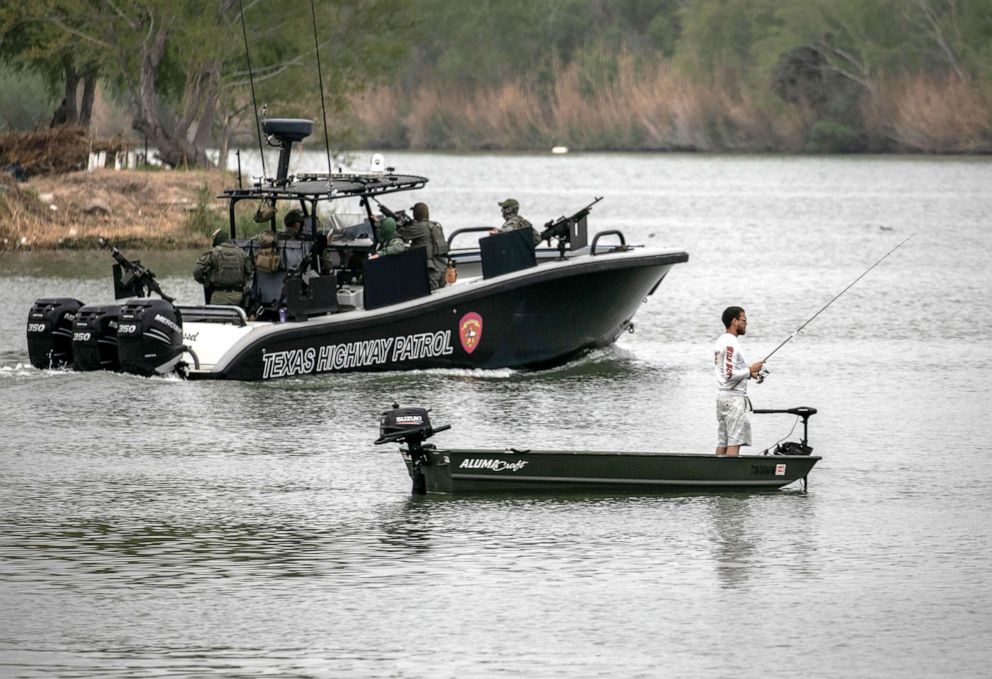 PHOTO: In this March 24, 2021, file photo, a Texas Department of Public Safety (DPS) boat patrols passes a Mexican fisherman on the Rio Grande near Mission, Texas.