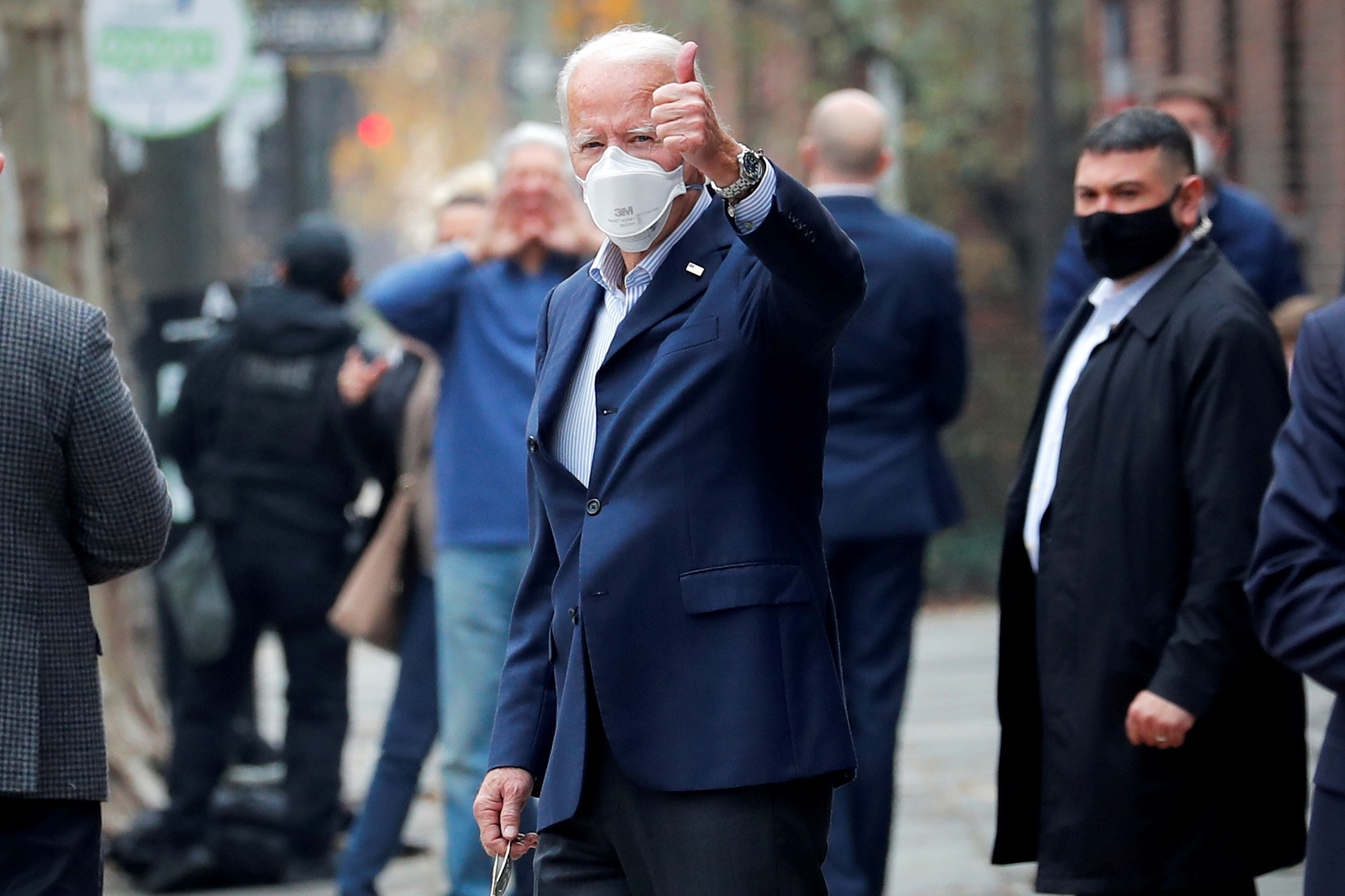 PHOTO: President-elect Joe Biden gives a thumbs-up and a wave to an on-looker who called out to him as he leaves Pennsylvania Hospital after a follow up appointment at the radiology department  in Philadelphia.