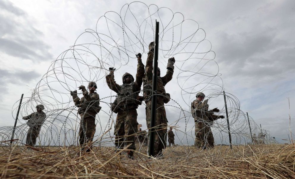 PHOTO: Members of a U.S Army engineering brigade place Concertina wire around an encampment for troops, Department of Defense and U.S. Customs and Border Protection near the U.S.-Mexico International bridge, Nov. 4, 2018, in Donna, Texas. 