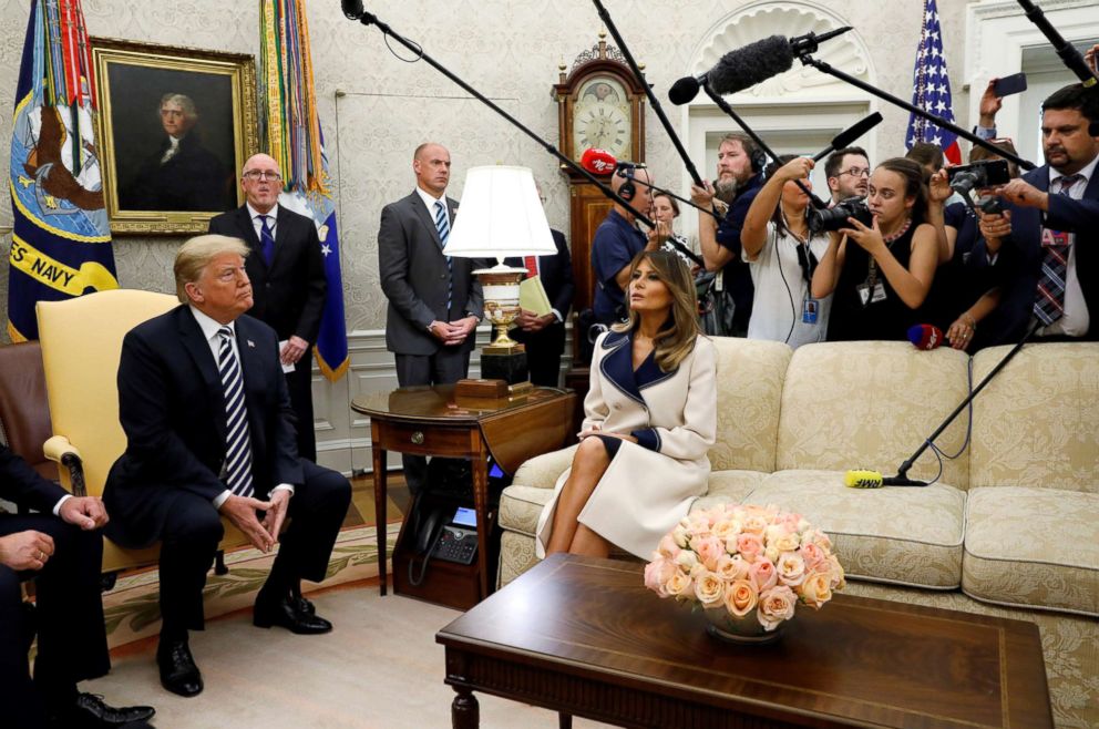 PHOTO: President Donald Trump listens to questions as he sits with first lady Melania Trump during a meeting with Poland's President Andrzej Duda in the Oval Office, Sept. 18, 2018.