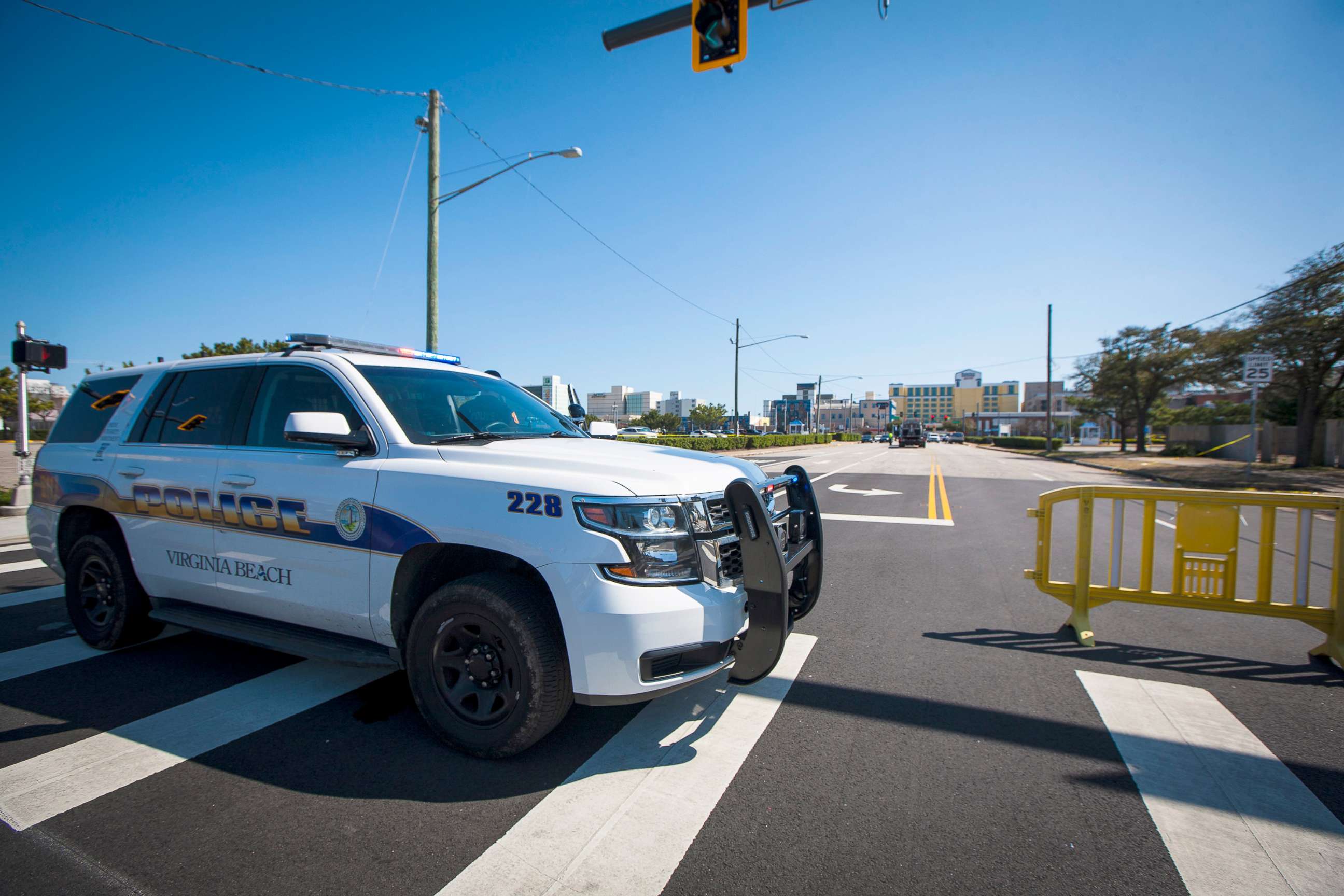 PHOTO: Virginia Beach police work the scene of a shooting the night before in Virginia Beach, Va., March 27, 2021.