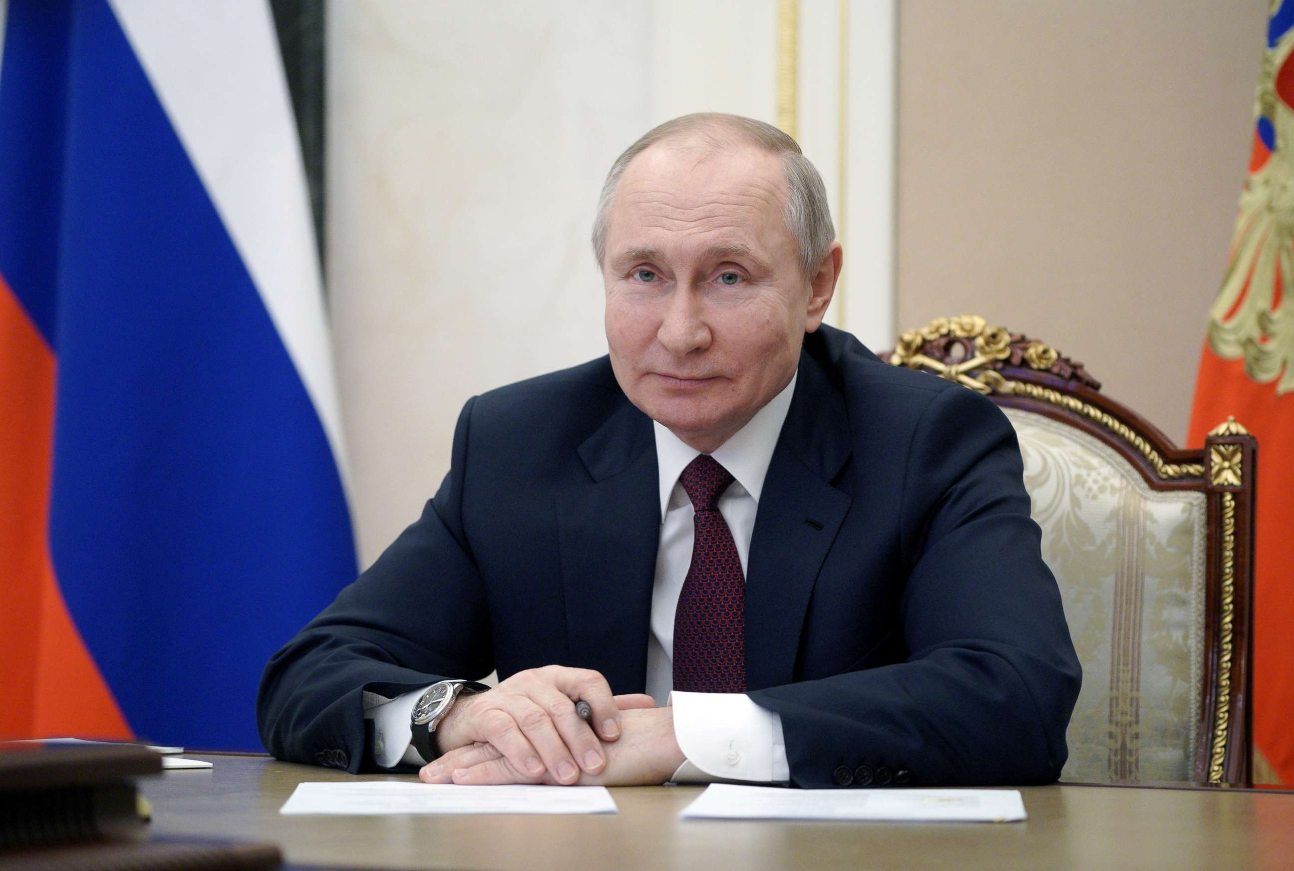 PHOTO: Russian President Vladimir Putin takes part in a meeting with community representatives and residents of Crimea and Sevastopol via a video link in Moscow, Russia March 18, 2021. 