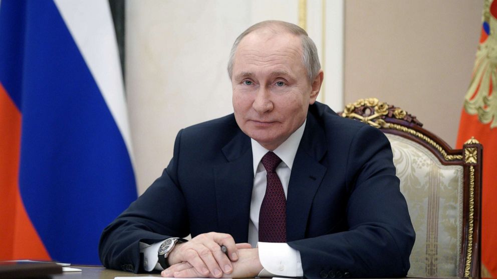 PHOTO: Russian President Vladimir Putin takes part in a meeting with community representatives and residents of Crimea and Sevastopol via a video link in Moscow, Russia March 18, 2021. 