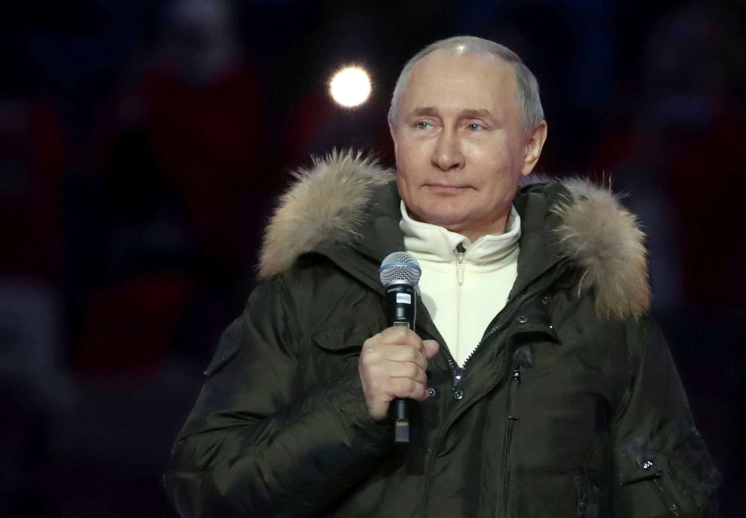 PHOTO: Russian President Vladimir Putin attends a concert marking the seventh anniversary of Russia's annexation of Crimea at Luzhniki Stadium in Moscow, March 18, 2021.