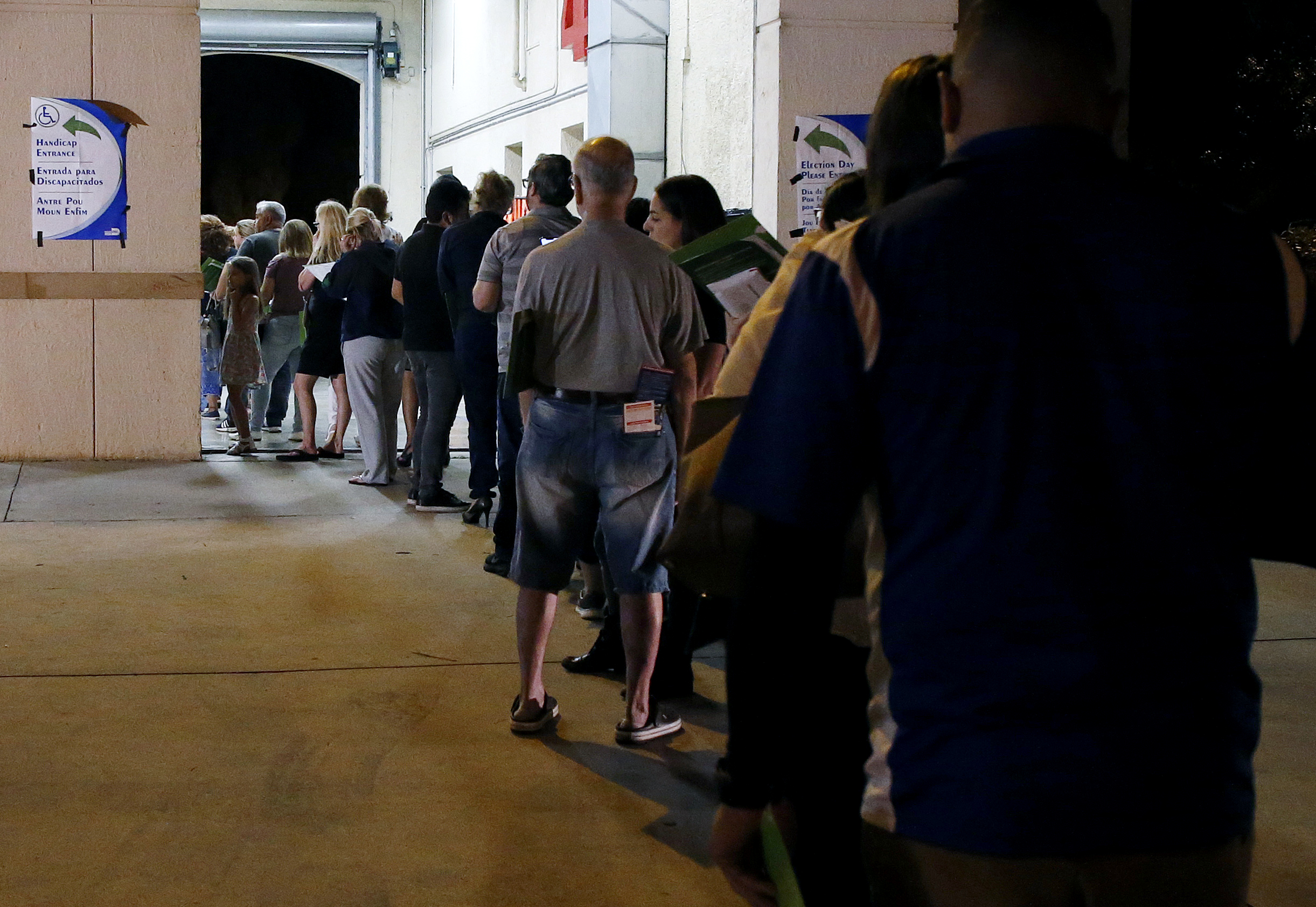 PHOTO: People wait in line to vote at a polling station in Miami, late Nov. 6, 2018. 